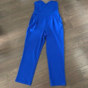 Royal Blue Express jumpsuit with gold zipper